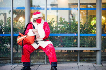 Santa Claus sitting in the bus station