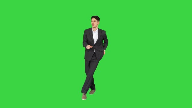 Very cool young dancing businessman on a Green Screen, Chroma Key.