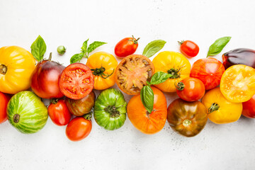 Mixed tomatoes top view. Composition with variety of colorful fresh organic tomatoes.