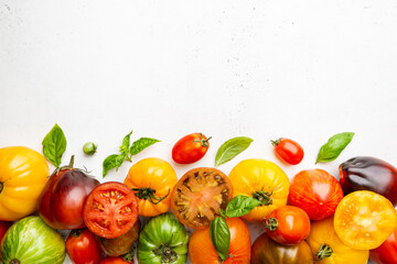 Mixed tomatoes top view. Composition with variety of colorful fresh organic tomatoes.