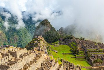 Fototapeta na wymiar Machu Picchu in mist and clouds, Cusco province, Peru.