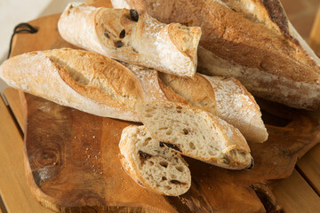 serving bread for Breakfast, sliced baguette with olives