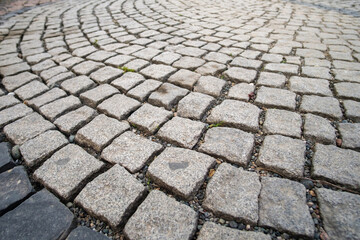 Pavement made from stone cubes in perspective, selective focus
