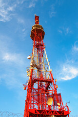 Bottom view of Pyatigorsk TV tower on background of blue sky with clouds in sunny day.