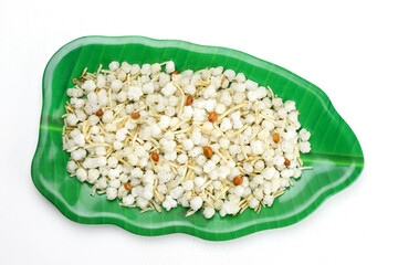 Indian snacks phalhari chiwda in green melamine plate. 