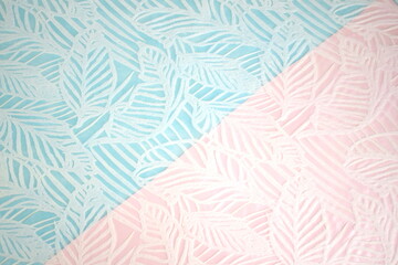 Fototapeta na wymiar A delicate background consisting of two parts - pink and blue, divided diagonally with the texture of leaves.