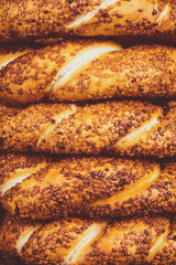 Bagel with sesame on black background	