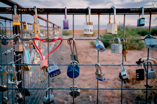 Various locks on a fence 