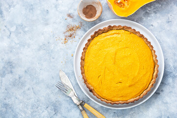 Uncooked squash or pumpkin tart, cooking autumn dessert. Homemade pastry