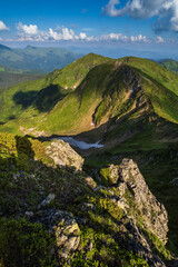 Summer mountain slope and small alpine lake in far. Pip Ivan Mountain, Carpathian, Ukraine.