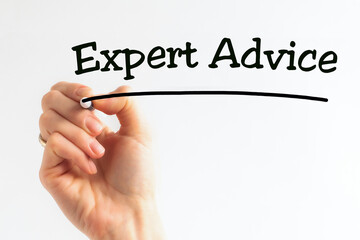 A person writes phrase Expert Advice with marker on a light background. Business concept.
