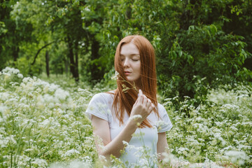 Naklejka premium World mental health day, work-life balance, spread positive messages concept. Redhead woman in business suit enjoying nature