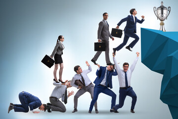 Career progression concept with businessman climbing stairs