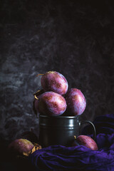 Red plums on black background