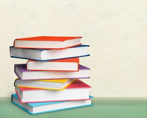 Stack of colorful books collection on the desk