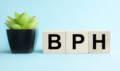 BPH (Benign Prostatic Hyperplasia). text on wood cubes on a BLUE background