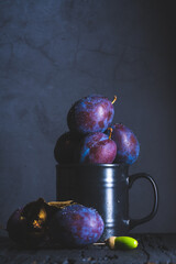 Red plums on black background