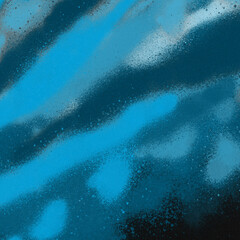 Blue spray paint ink texture. Graffiti painting on the wall. Street art and vandalism. Digitally airbrushed paper background.