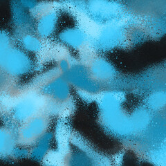 Blue spray paint ink texture. Graffiti painting on the wall. Street art and vandalism. Digitally airbrushed paper background.