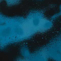 Blue spray paint ink texture. Graffiti painting on the wall. Street art and vandalism. Digitally airbrushed paper background.