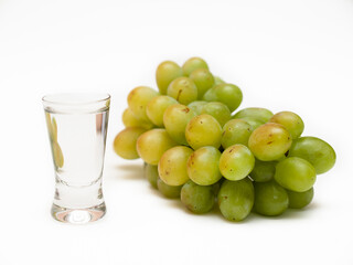 Green grapes and a glass of liqueur