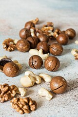 An organic blend of macadamia nuts, cashews, walnuts. Healthy product, superfood and healthy food concept. Mix of nuts 