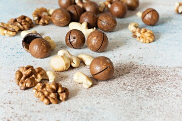 An organic blend of macadamia nuts, cashews, walnuts. Healthy product, superfood and healthy food concept. Mix of nuts 