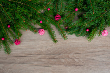 Fototapeta na wymiar Christmas decorations on a wooden background. Winter holiday theme. Happy New Year. Space for text.