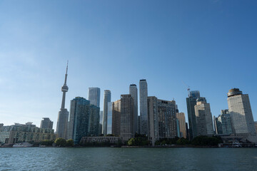 Fototapeta na wymiar Toronto City Skyline from the ferry on a sunny day in Ontario Canada