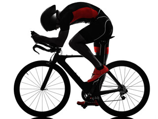Fototapeta na wymiar triathlete triathlon Cyclist cycling in studio silhouette shadow isolated on white background