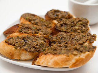 Tapenade on baguette slices