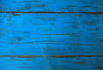 The texture of the wood surface is blue with cracks