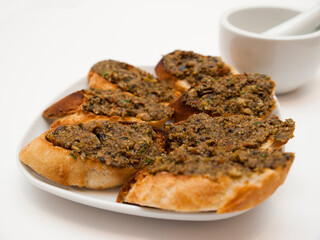 Tapenade on baguette slices