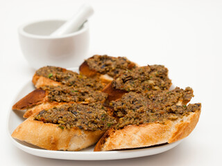 Tapenade on baguette slices