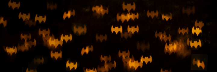 Creative abstract background with bokeh in the form of bats.Halloween background.
