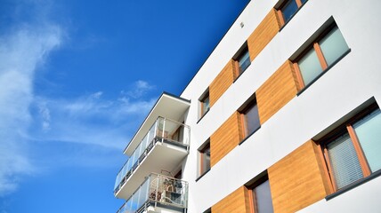 Futuristic square architecture of apartment building for real estate with big windows.