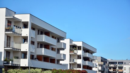 Futuristic square architecture of apartment building for real estate with big windows.
