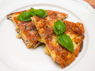Spanish tortilla with mushrooms and basil