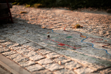 Closeup of colorful patterns on the weathered natural paving cobblestone