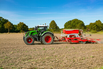 Tractor with drilling machine in the field