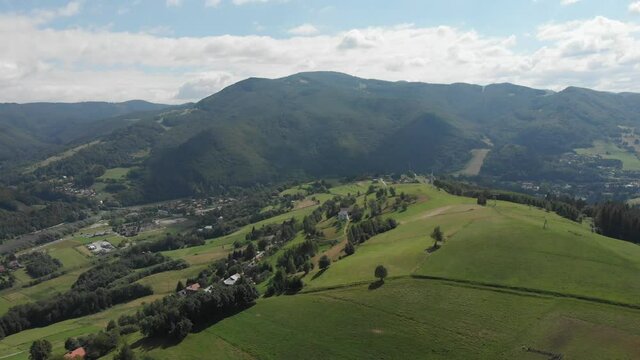 Flying over Beskid Sadecki Mountains in summer near village Rytro and Polom mountain, Poland. View of Makowica and Jaworzyna Range.