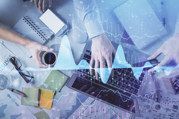 Double exposure of man and woman working together and forex graph hologram drawing. Financial analysis concept. Computer background. Top View.