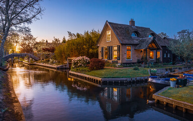 Lovely sunset over canal and picturesque houses, Giethoorn, Netherlands