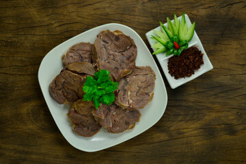 Braised Beef Shank slice ontop corainder thai herb served Galangal chili paste Thai northern Style