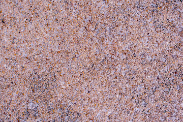 Natural color sand wash surface floor made of small sand stone. Image for background texture.