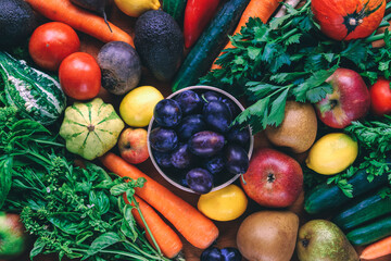 Organic fresh vegetables and fruits. Vegan healthy raw food background, top view.
