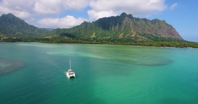 Boat off Hawaiian coastline, wide aerial