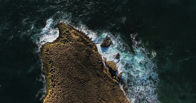 Overhead Aerial, Waves Crash On Rocky Shore