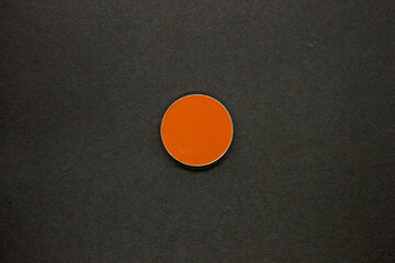 Neon Orange Eyeshadow isolated on a Black background