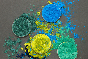 Shades of Blue and Green crushed Eyshadow on a Black background